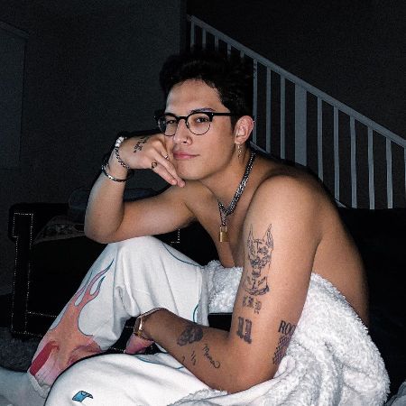 Brandon showing off his arm tattoos.